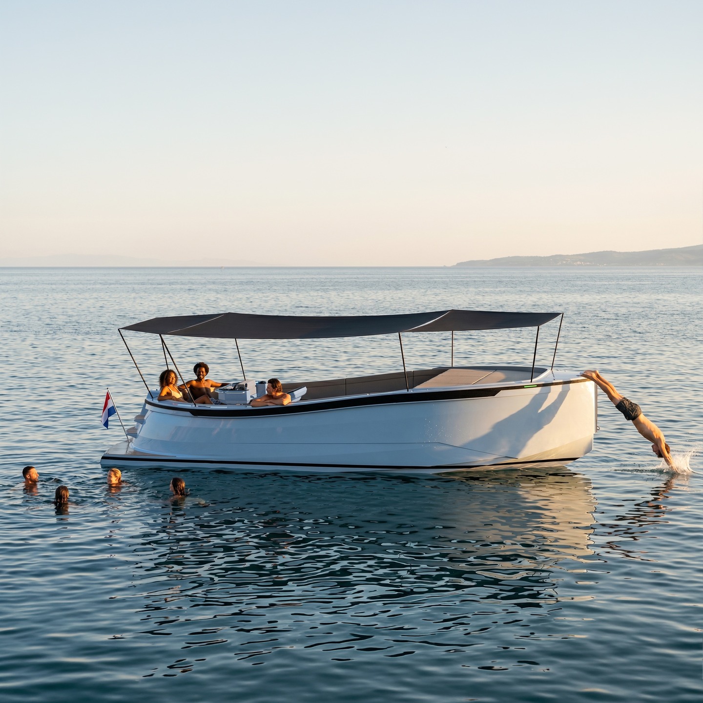 Lowlander at anchor with friends swimming